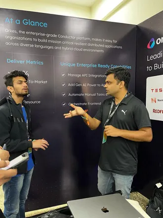 Manan handling a customer enquiry at an event